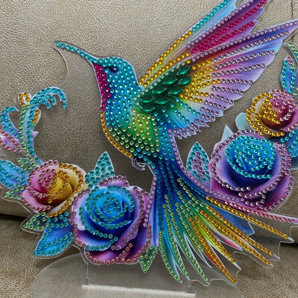 Colorful Hummingbird and Roses Accent Piece.  On a Stand